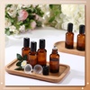 image:imageSumind 24 Sets Clear 30ml Roller Glass Bottle Essential Oil with Stainless Steel Refillable Sample Container Brown Empty Roller Bottle Applicator with Funnel Sticker for TravelAmber